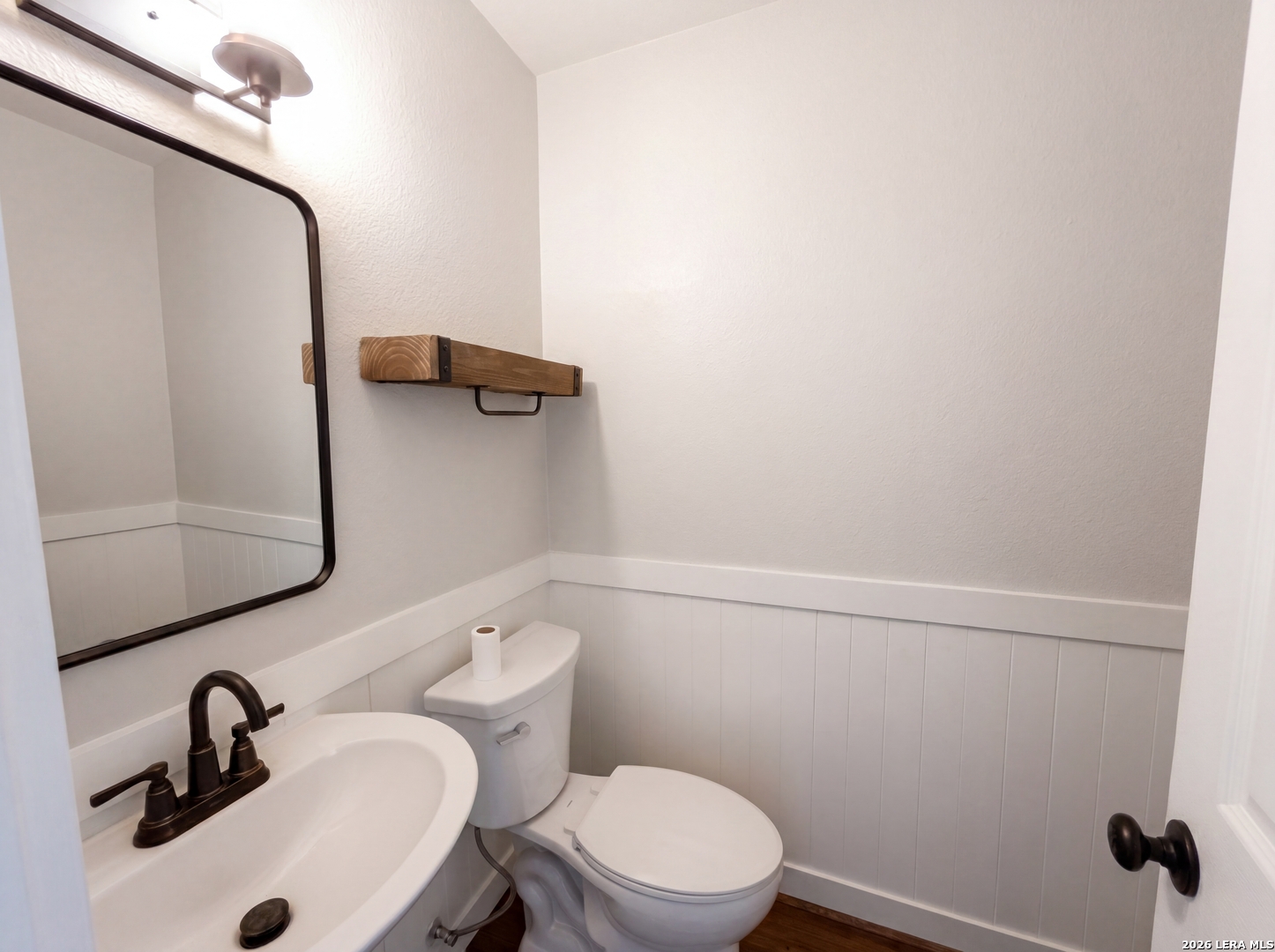 15422 Geronimo Loop San Antonio, TX 78254 - Photo 16 of 21 a bathroom with a sink a toilet and mirror