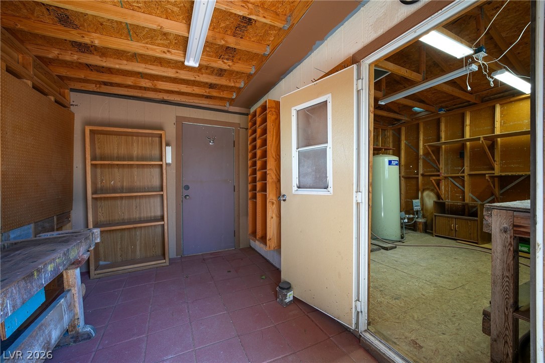 1831 West Horn Road Pahrump, NV 89048 - Photo 40 of 59 Functional workspace with built-in shelving, ready for projects.