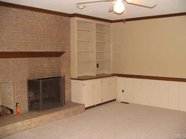 808 Thatcher Way Raleigh, NC 27615 - Photo 5 of 10 a view of an empty room with a fireplace