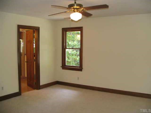 808 Thatcher Way Raleigh, NC 27615 - Photo 6 of 10 an empty room with windows and fan