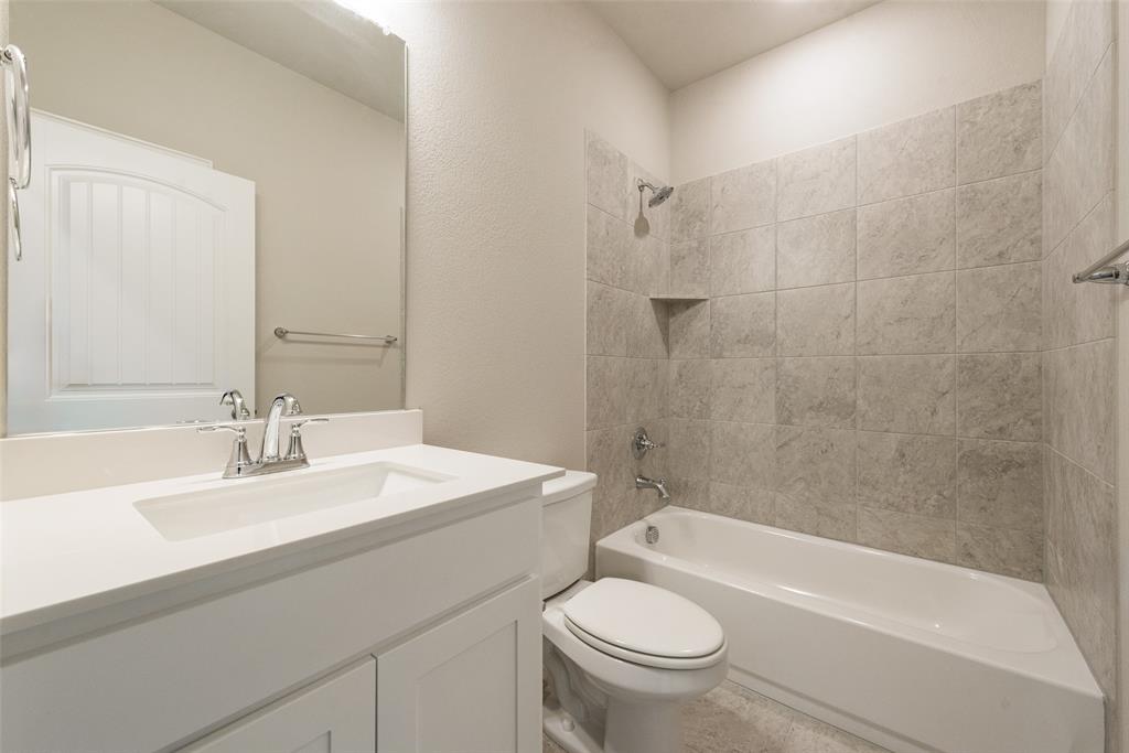 1230 County Road 200 Valley View, TX 76272 - Photo 21 of 26 Full bath with vanity, tub / shower combination, and a textured wall