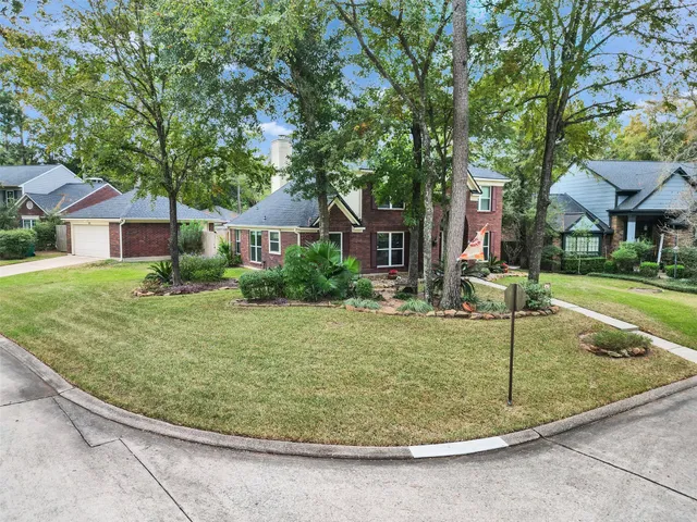 a view of a house with a backyard porch and sitting area
