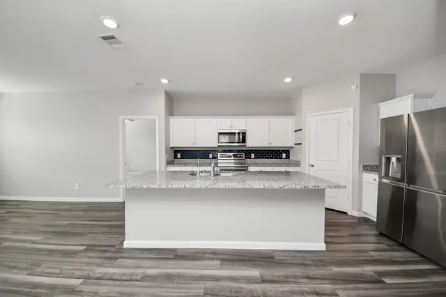 a bathroom with a sink mirror and a shower