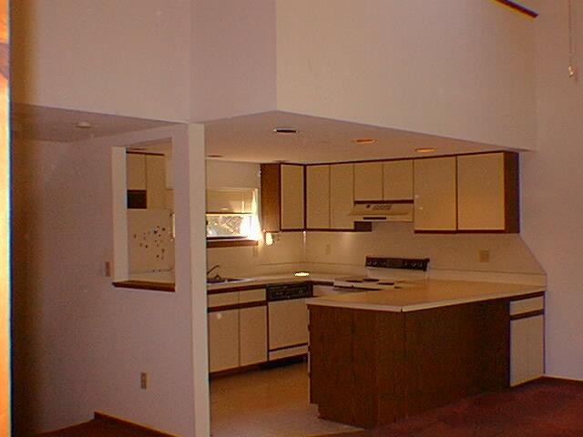 613 Mountain View Way Bushkill, PA 18324 - Photo 2 of 3 a kitchen with stainless steel appliances granite countertop a sink stove and refrigerator