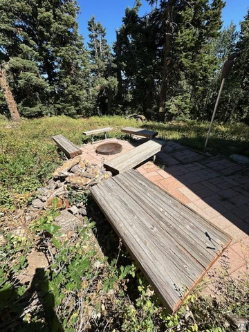 1456 Navajo Road Coalville, UT 84017 - Photo 47 of 55 Deck with a patio and an outdoor fire pit