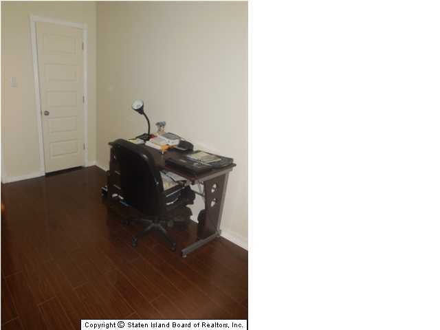 1640 Forest Hill Road Staten Island, NY 10314 - Photo 15 of 20 a living room with table and chair