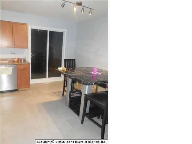 1640 Forest Hill Road Staten Island, NY 10314 - Photo 4 of 20 a workspace with furniture and a window