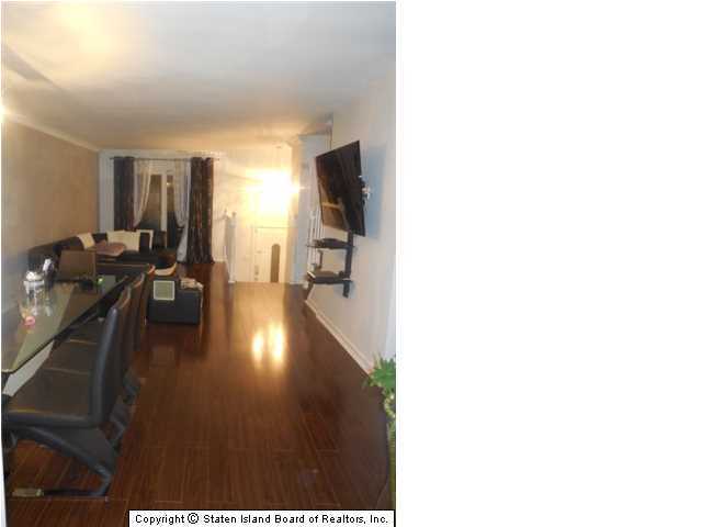 1640 Forest Hill Road Staten Island, NY 10314 - Photo 6 of 20 a living room with furniture and wooden floor