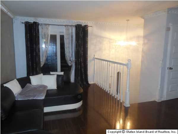 1640 Forest Hill Road Staten Island, NY 10314 - Photo 7 of 20 a bathroom with a sink and a mirror