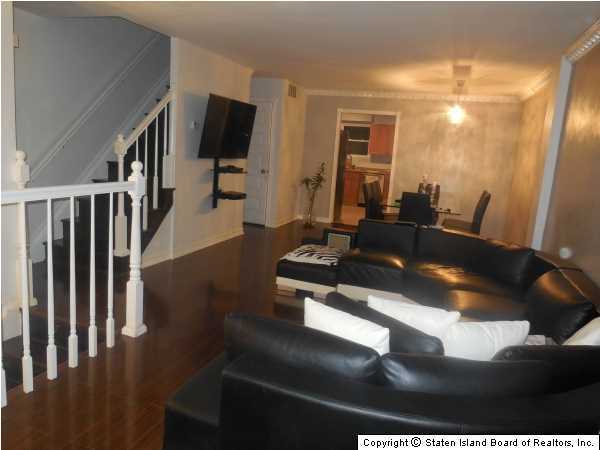 1640 Forest Hill Road Staten Island, NY 10314 - Photo 8 of 20 a living room with wooden floor