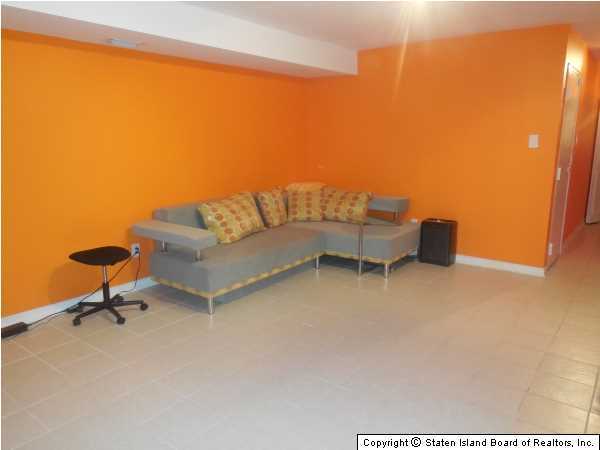 1640 Forest Hill Road Staten Island, NY 10314 - Photo 9 of 20 a living room with furniture and a window