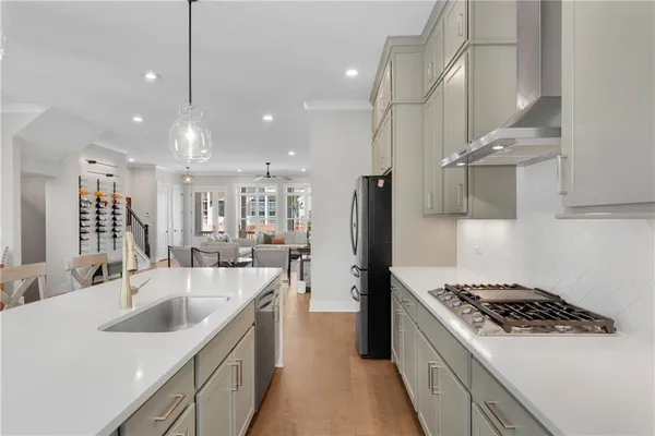 a bathroom with a sink and mirror with toilet
