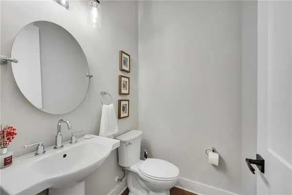 a spacious bathroom with a double vanity sink a mirror and a shower