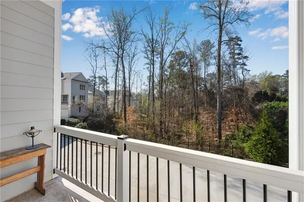 a view of a balcony with furniture