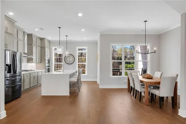 a bedroom with a bed a window and chair