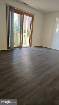a view of storage and utility room with a door