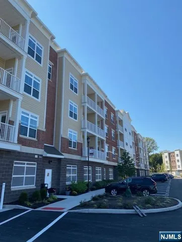 a front view of a building with garden