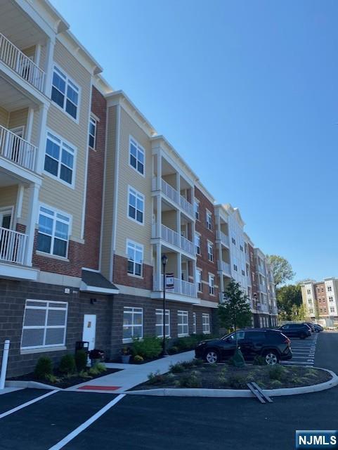 a front view of a building with garden