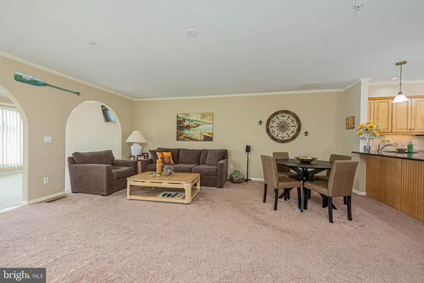 a living room with furniture and a table