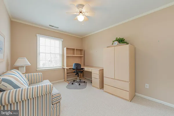 a view of bedroom with furniture and wooden floor