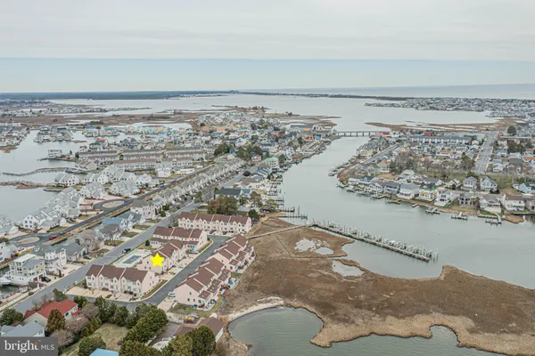 an aerial view of a house with a ocean view