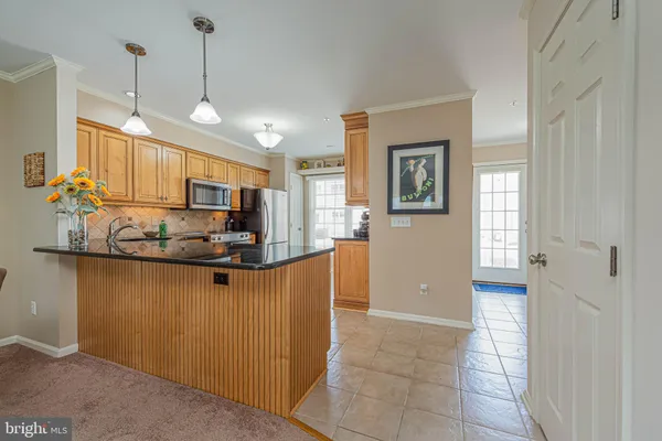 a view of a livingroom with furniture and a large window
