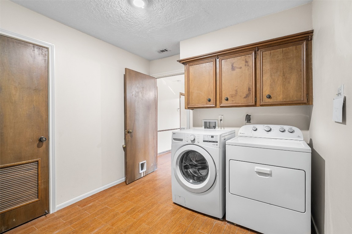 723 Shadow Brook Drive Spring, TX 77380 - Photo 20 of 44 a utility room with dryer and washer