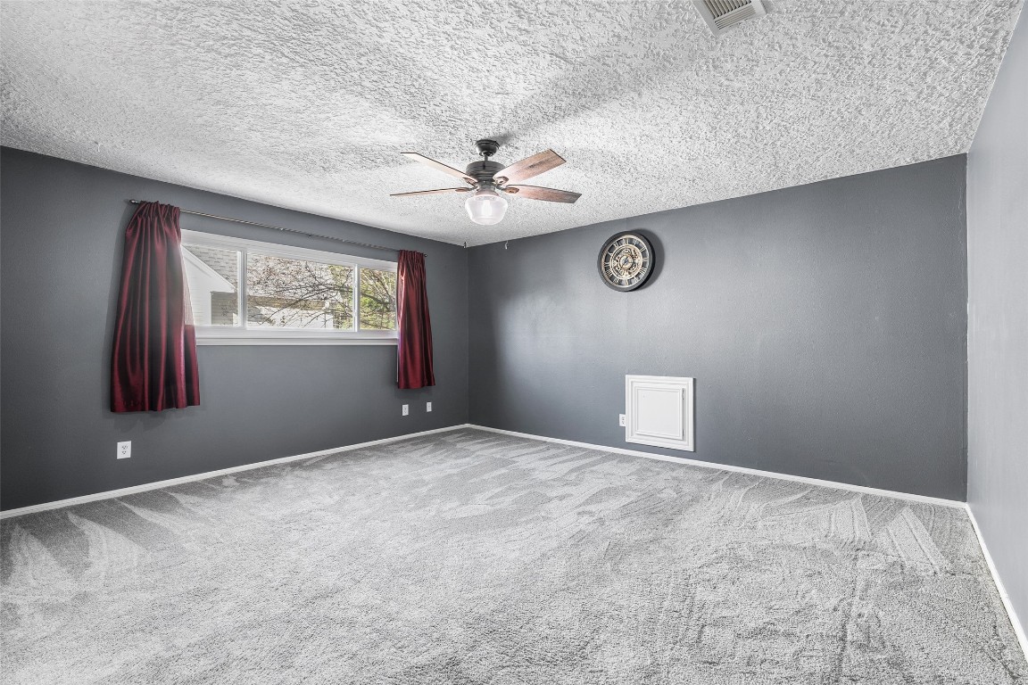 723 Shadow Brook Drive Spring, TX 77380 - Photo 22 of 44 an empty room with windows and fan