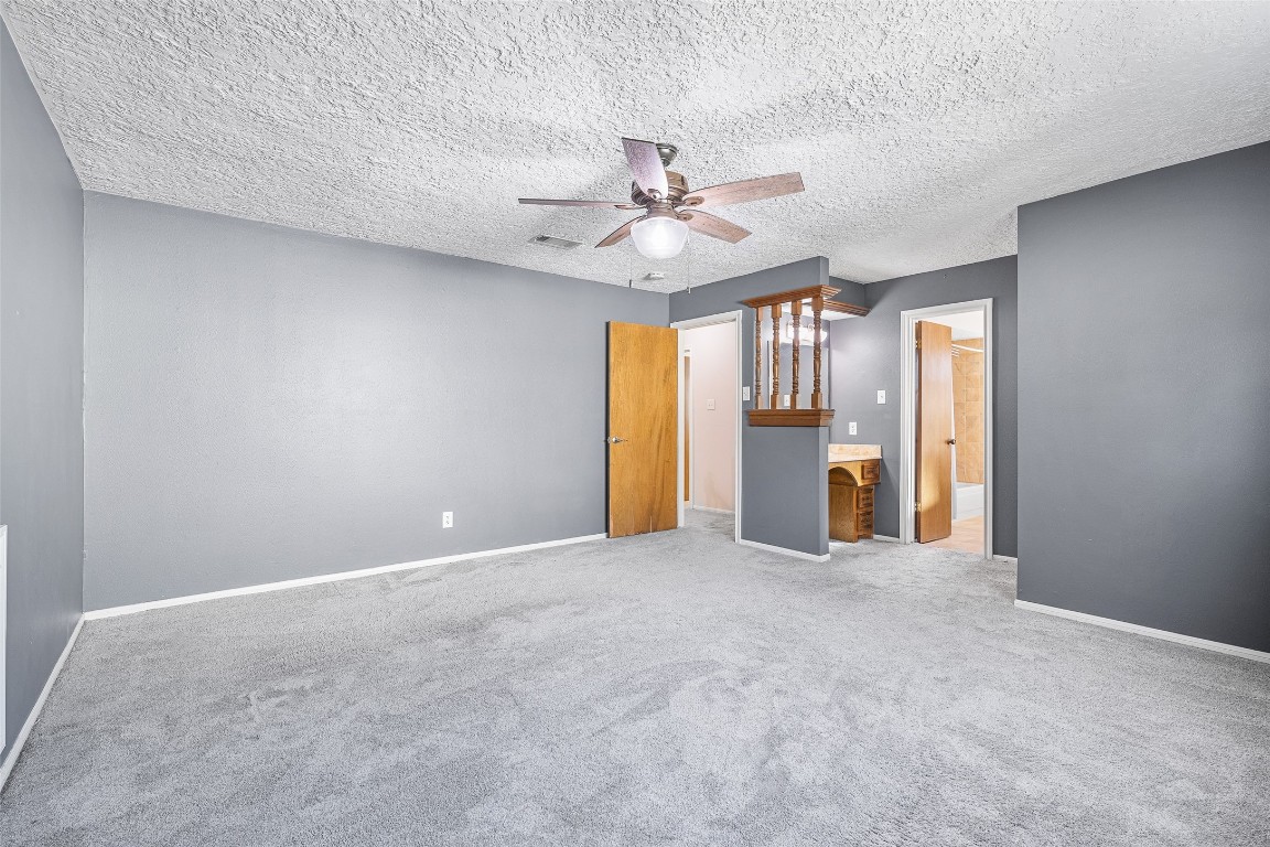 723 Shadow Brook Drive Spring, TX 77380 - Photo 23 of 44 an empty room with chandelier fan and windows