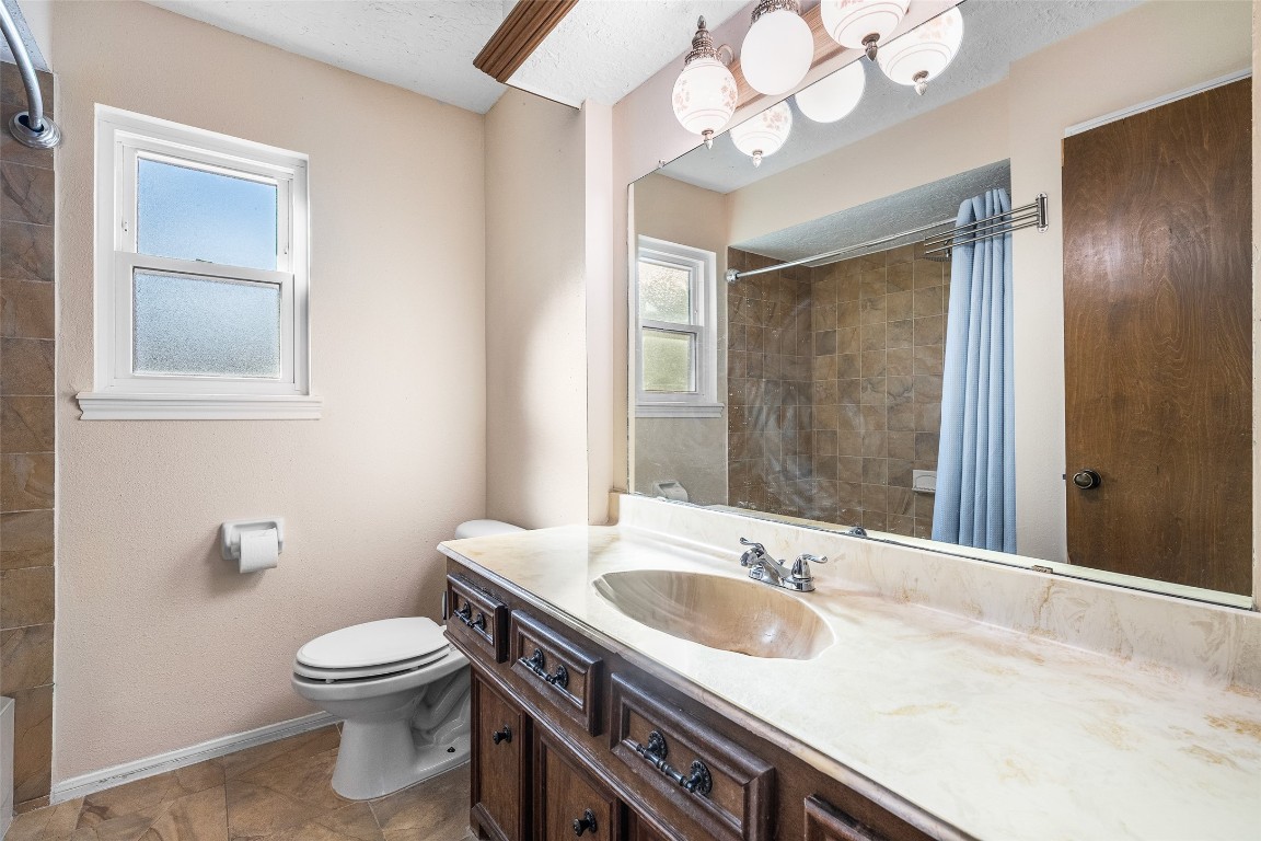 723 Shadow Brook Drive Spring, TX 77380 - Photo 24 of 44 a bathroom with a sink a toilet and a mirror