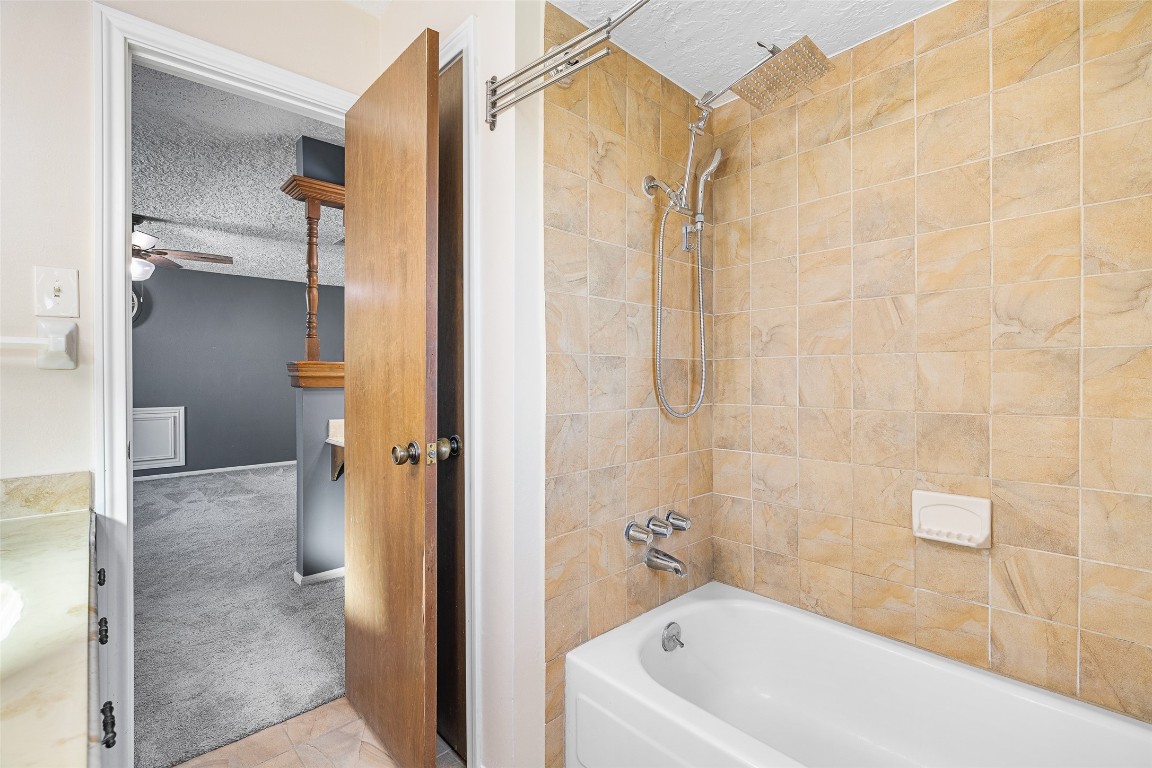 723 Shadow Brook Drive Spring, TX 77380 - Photo 25 of 44 a bathroom with a bathtub and shower