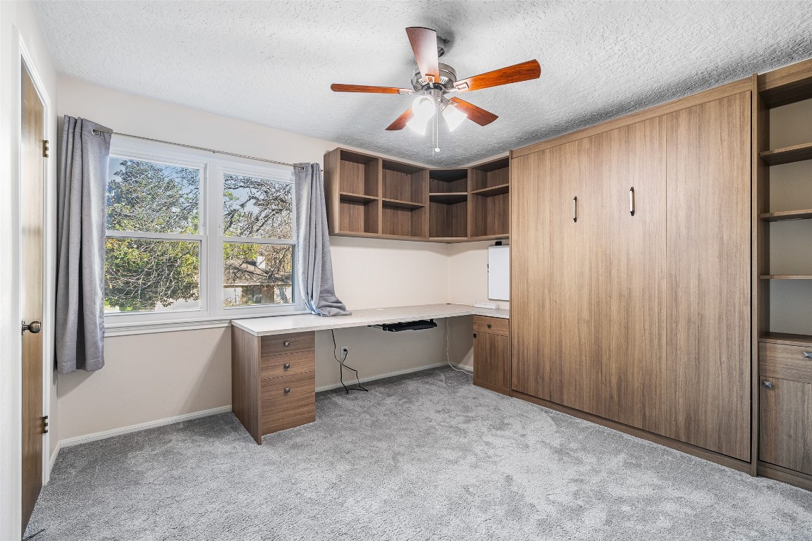 723 Shadow Brook Drive Spring, TX 77380 - Photo 26 of 44 a large room with a large window and chandelier