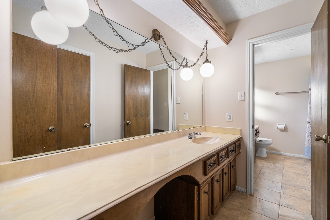 723 Shadow Brook Drive Spring, TX 77380 - Photo 30 of 44 a bathroom with a sink a vanity and a mirror