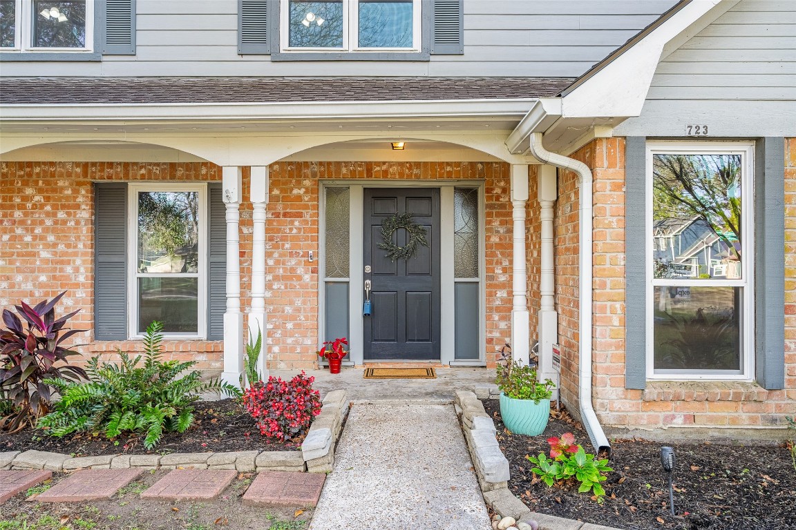 723 Shadow Brook Drive Spring, TX 77380 - Photo 3 of 44 a front view of a house with a outdoor shower and swimming pool