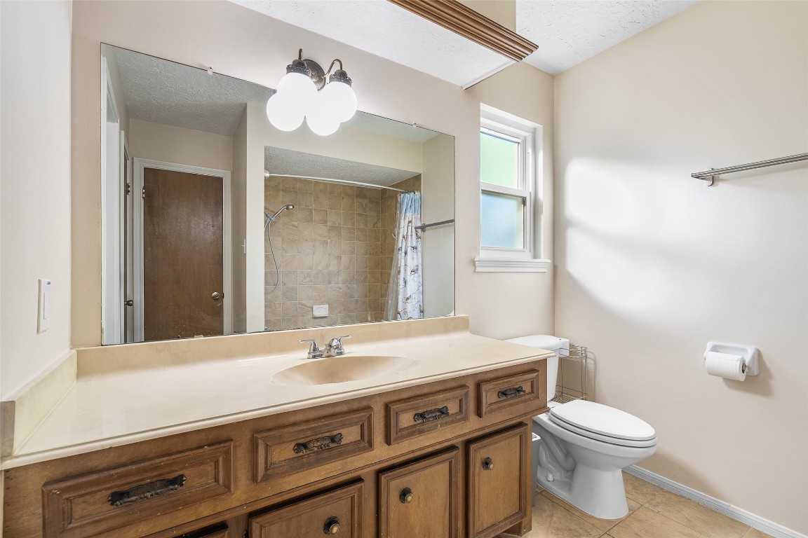 723 Shadow Brook Drive Spring, TX 77380 - Photo 32 of 44 a bathroom with a sink a toilet and mirror