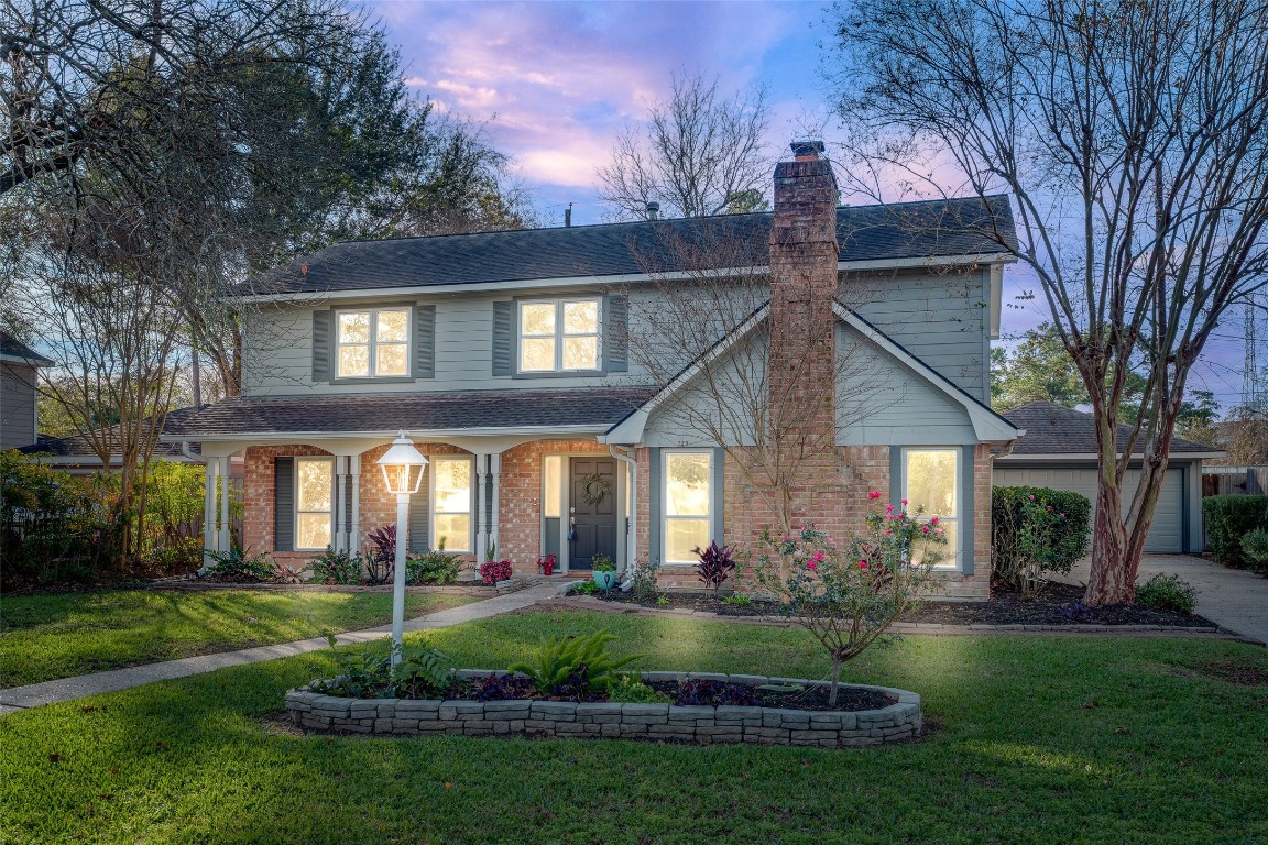 723 Shadow Brook Drive Spring, TX 77380 - Photo 44 of 44 a view of a house with brick walls and a yard with plants