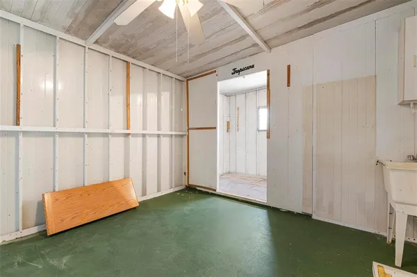 a view of a storage & utility room with a window