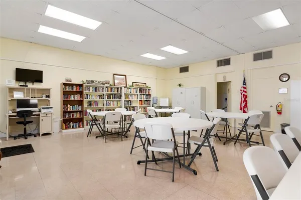 a living room with lots of furniture and a flat screen tv