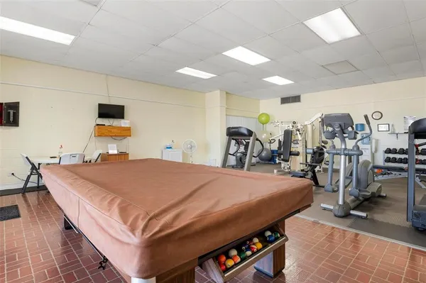 a bedroom with a bed and a table