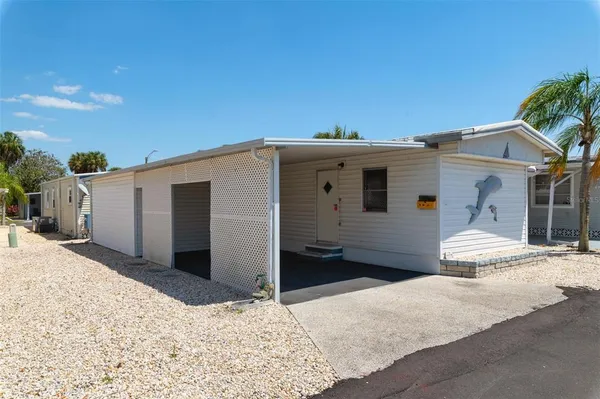 a view of a house with a snow in the background
