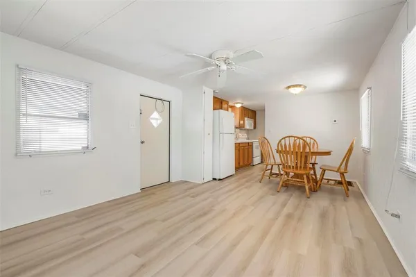 a view of a livingroom with furniture and wooden floor