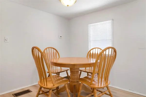 a view of a dining room with furniture