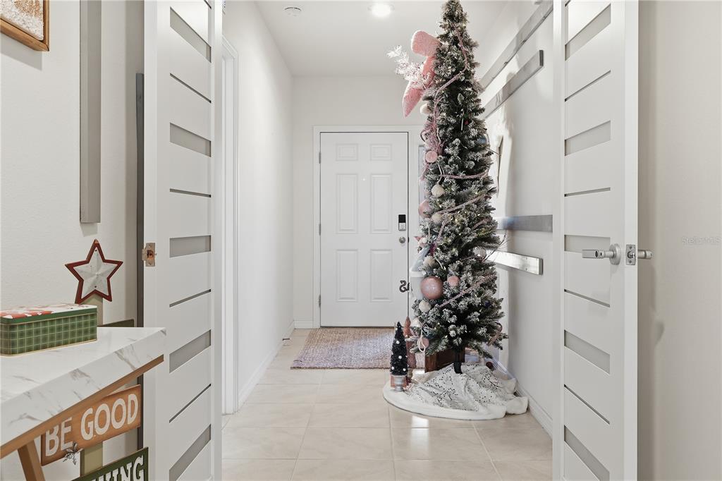 3862 Resting Robin Avenue Bartow, FL 33830 - Photo 14 of 41 a view of a hallway to a window and a flower pot