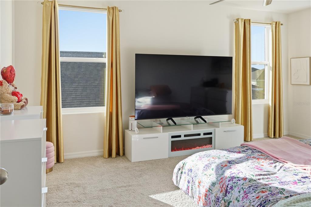 3862 Resting Robin Avenue Bartow, FL 33830 - Photo 24 of 41 a bedroom with a bed and a flat screen tv