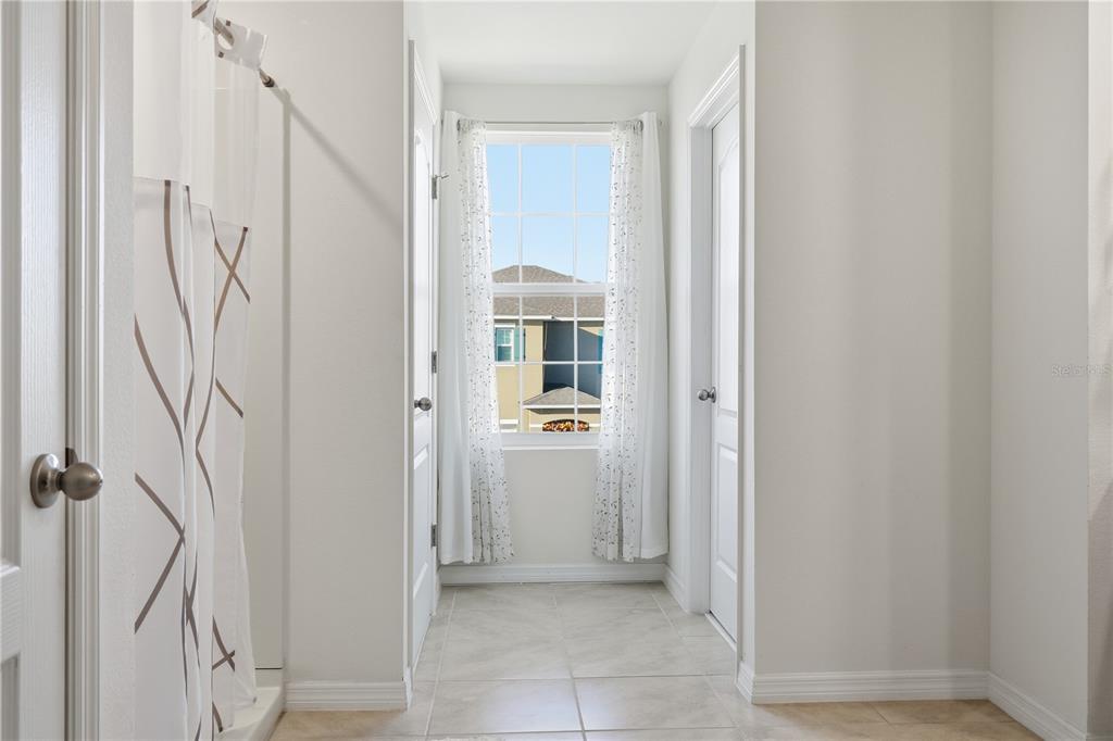 3862 Resting Robin Avenue Bartow, FL 33830 - Photo 26 of 41 a view of a hallway with wooden floor and entryway