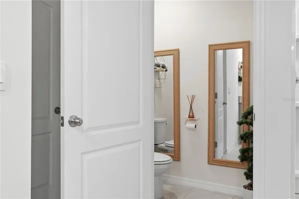 a bathroom with a granite countertop toilet a sink and shower