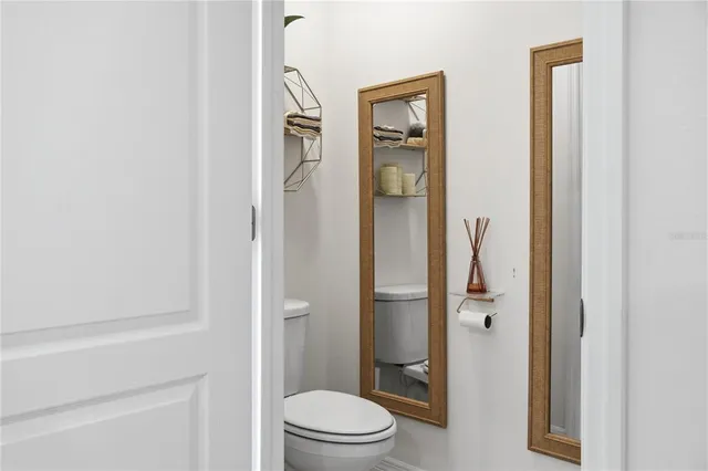 a bathroom with a shower and a mirror