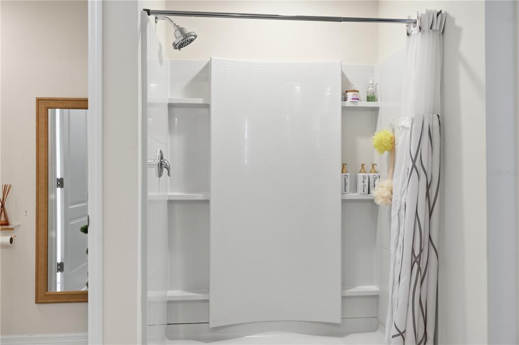 3862 Resting Robin Avenue Bartow, FL 33830 - Photo 29 of 41 a bathroom with a shower and a mirror