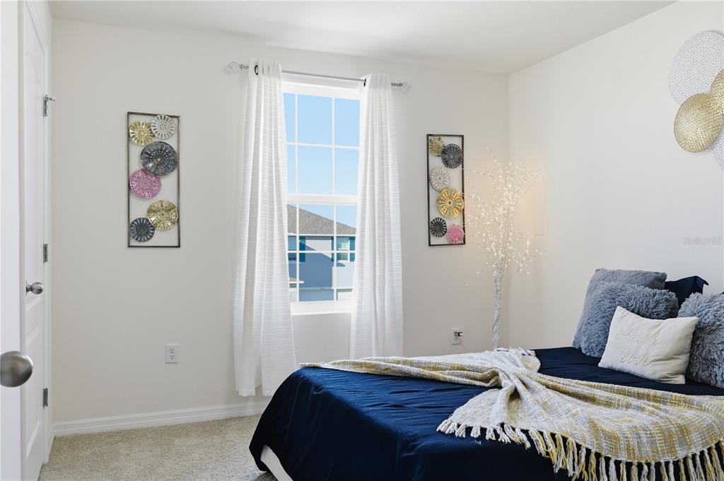 3862 Resting Robin Avenue Bartow, FL 33830 - Photo 31 of 41 a bedroom with a bed and painting on the wall