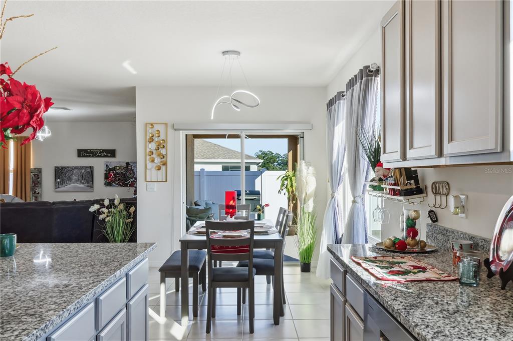 3862 Resting Robin Avenue Bartow, FL 33830 - Photo 9 of 41 a kitchen with stainless steel appliances granite countertop a stove refrigerator and cabinets